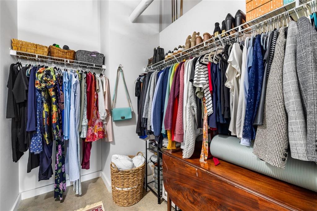 170 Boulevard Southeast, Unit 211H Atlanta, GA 30312 - Photo 25 of 49 a view of walk in closet with clothes