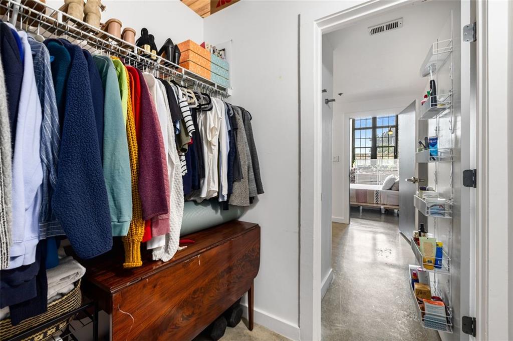 170 Boulevard Southeast, Unit 211H Atlanta, GA 30312 - Photo 26 of 49 a view of walk in closet with clothes and shoes