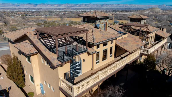 an aerial view of a house with roof deck
