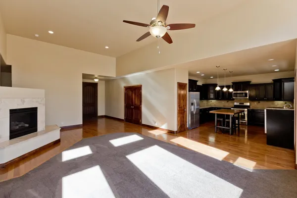 a view of a livingroom with furniture and a kitchen