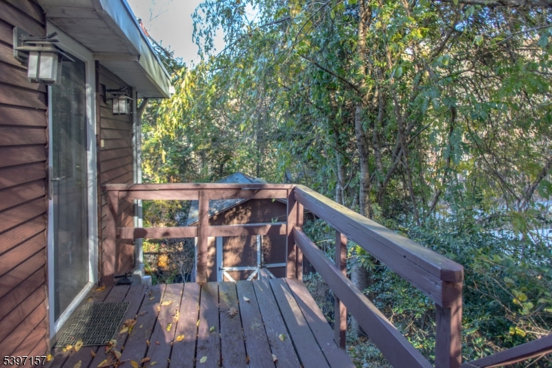 18 Decker Pond Road Vernon, NJ 07461 - Photo 13 of 40 a balcony with wooden floor and outdoor seating