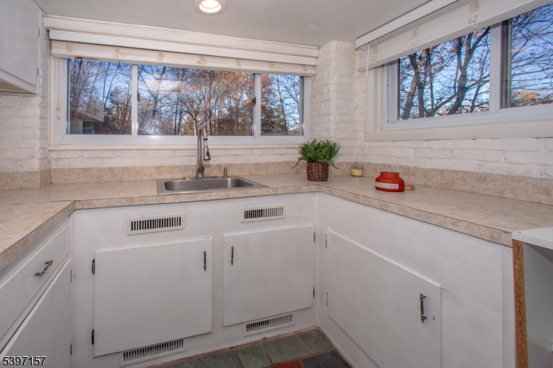 18 Decker Pond Road Vernon, NJ 07461 - Photo 30 of 40 a kitchen with a sink and cabinets
