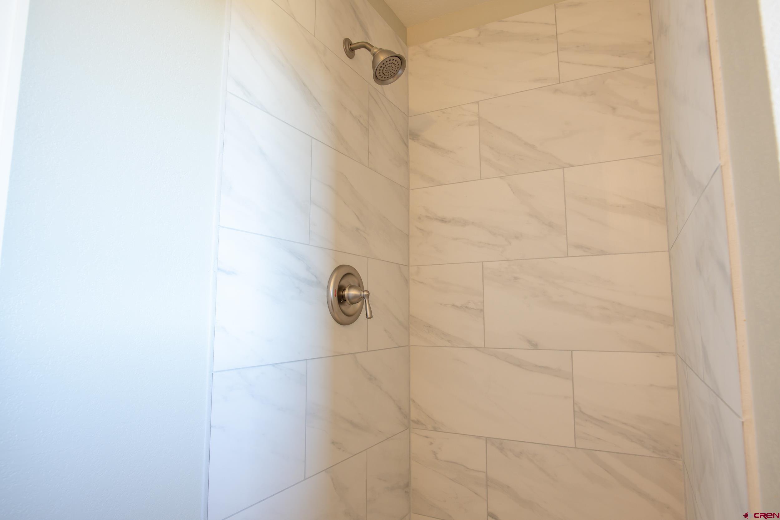 53086 Easter Road Olathe, CO 81425 - Photo 34 of 35 Nicely remodeled tiled shower located in 3/4 bath downstairs