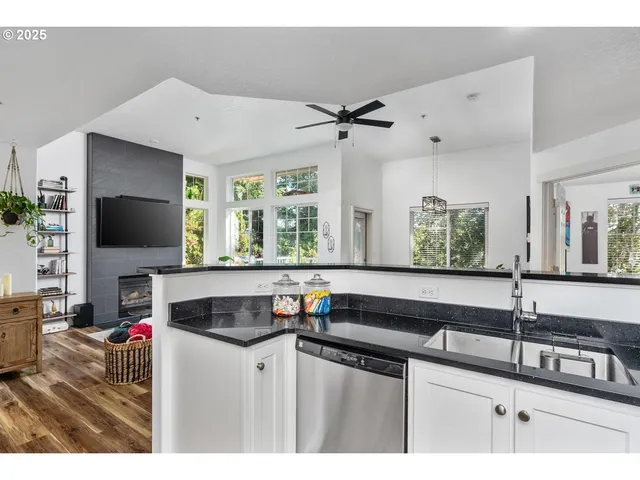 a bedroom with a bed and a potted plant