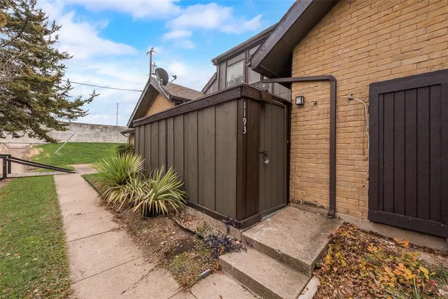 a couple of potted plants in front of door