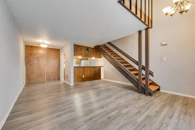 a view of an entryway with wooden floor