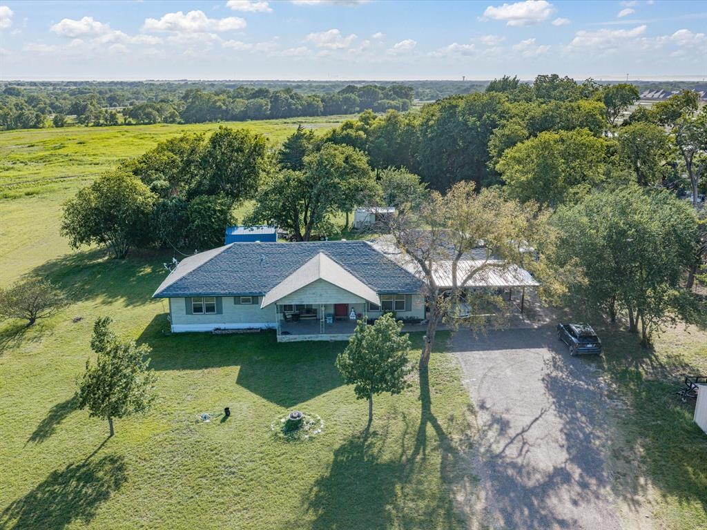 301 Ovilla Road Waxahachie, TX 75167 - Photo 1 of 38 an aerial view of a house with a yard and lake view