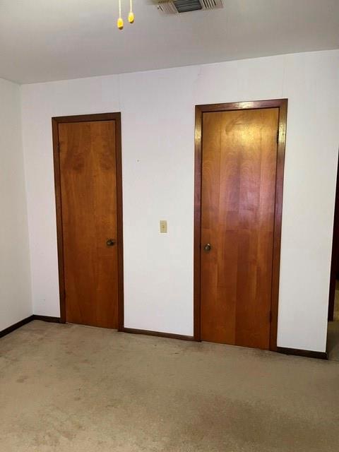 304 Sunset Street Roxton, TX 75477 - Photo 9 of 31 an empty room with closet and door