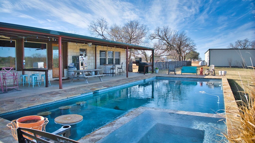 6446 Blackjack Road Fredonia, TX 76842 - Photo 38 of 48 a view of kitchen with furniture and a swimming pool