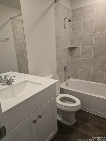 a bathroom with a sink a toilet and a bathtub
