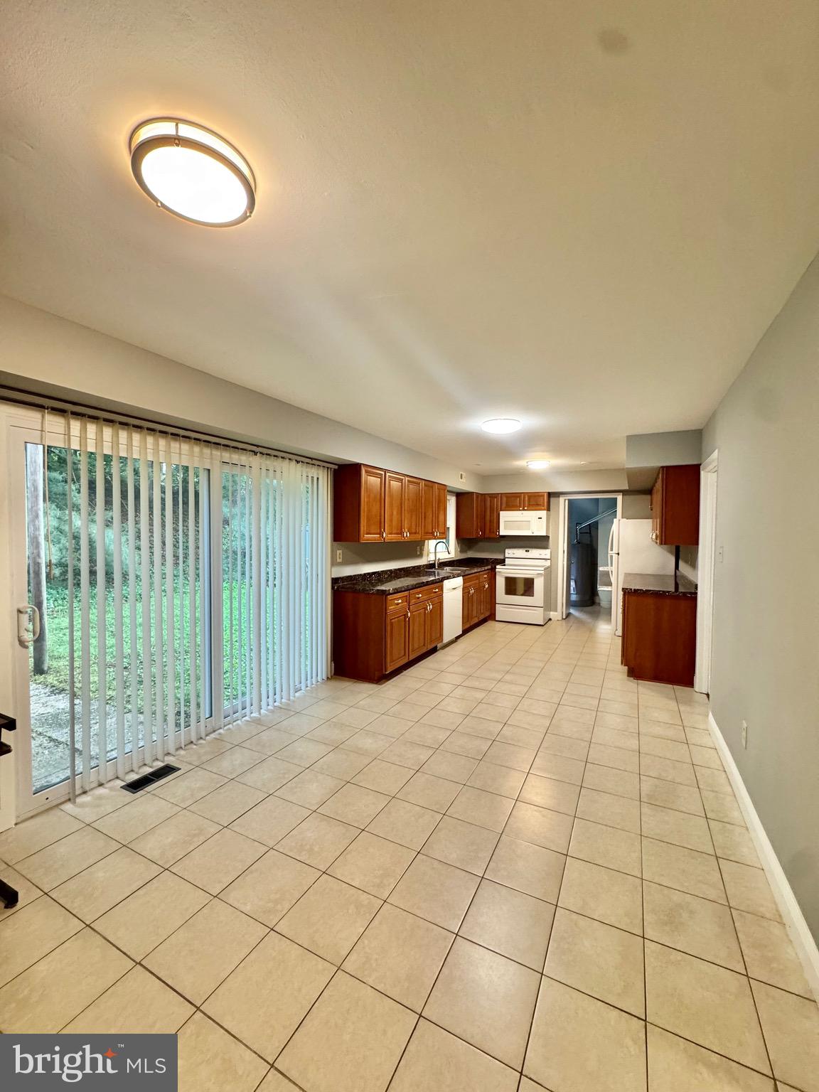 4908 Rocky Spring Lane Bowie, MD 20715 - Photo 12 of 36 a view of empty room with wooden floor