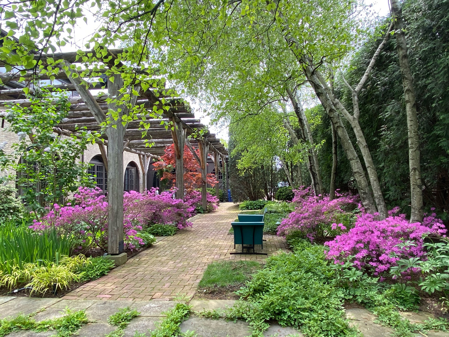 96 Ronan Road Highwood, IL 60040 - Photo 30 of 33 a view of a garden with flowers and trees