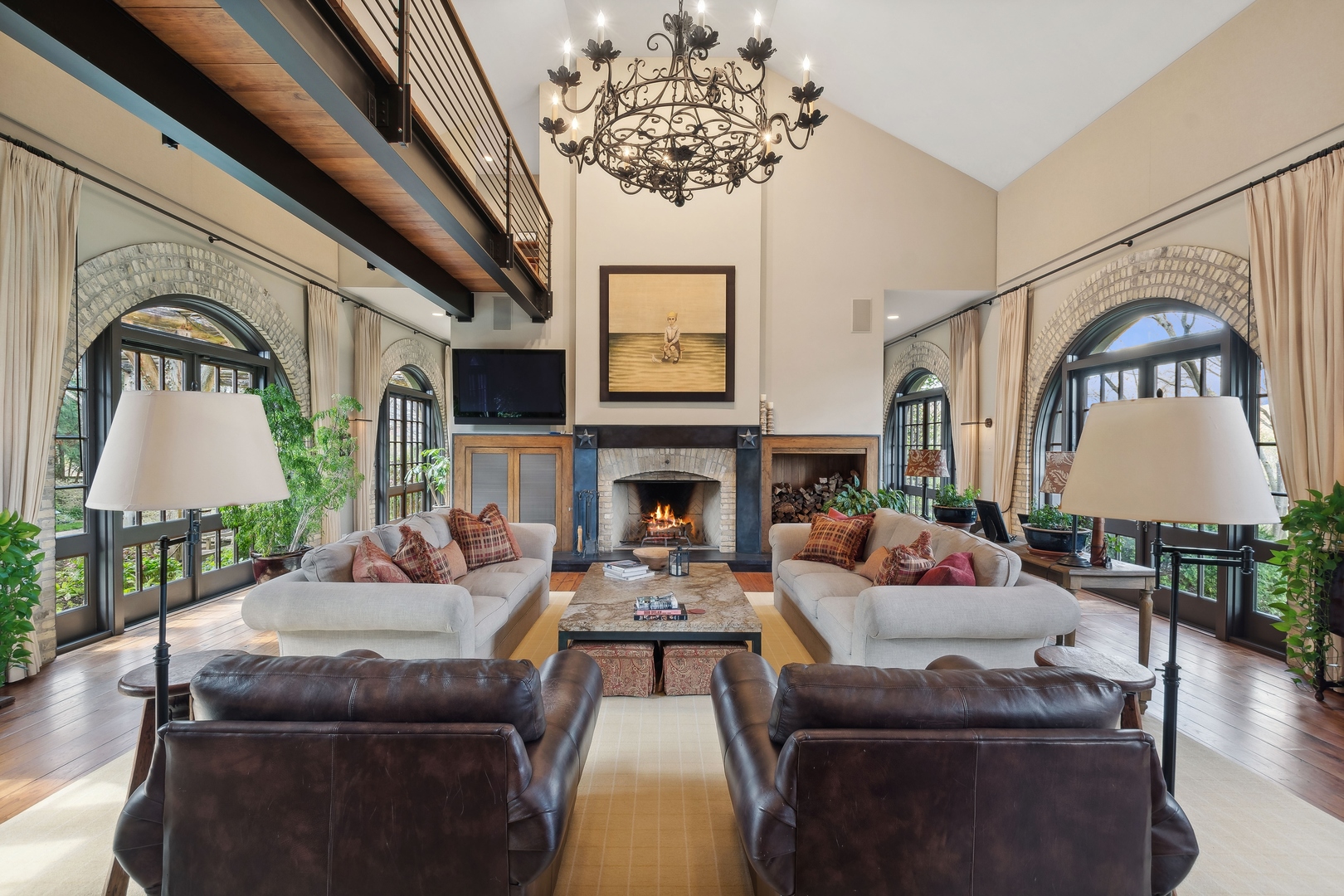 96 Ronan Road Highwood, IL 60040 - Photo 7 of 33 a living room with furniture a fireplace and a chandelier