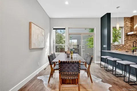 a bedroom with a large bed and a potted plant