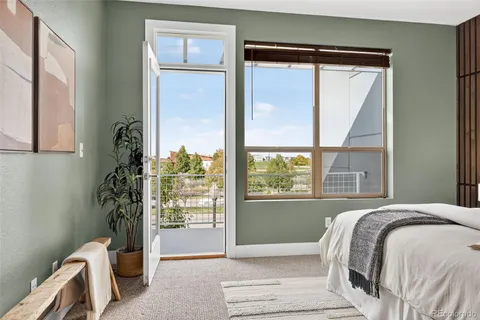 a view of an empty room with a kitchen