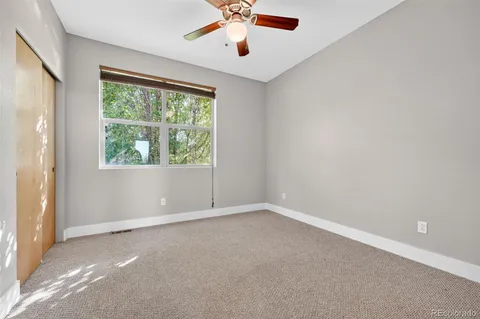 a picture of a bench in front of a wall