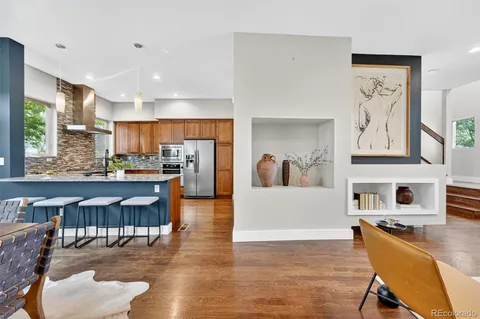a kitchen with cabinets and stainless steel appliances
