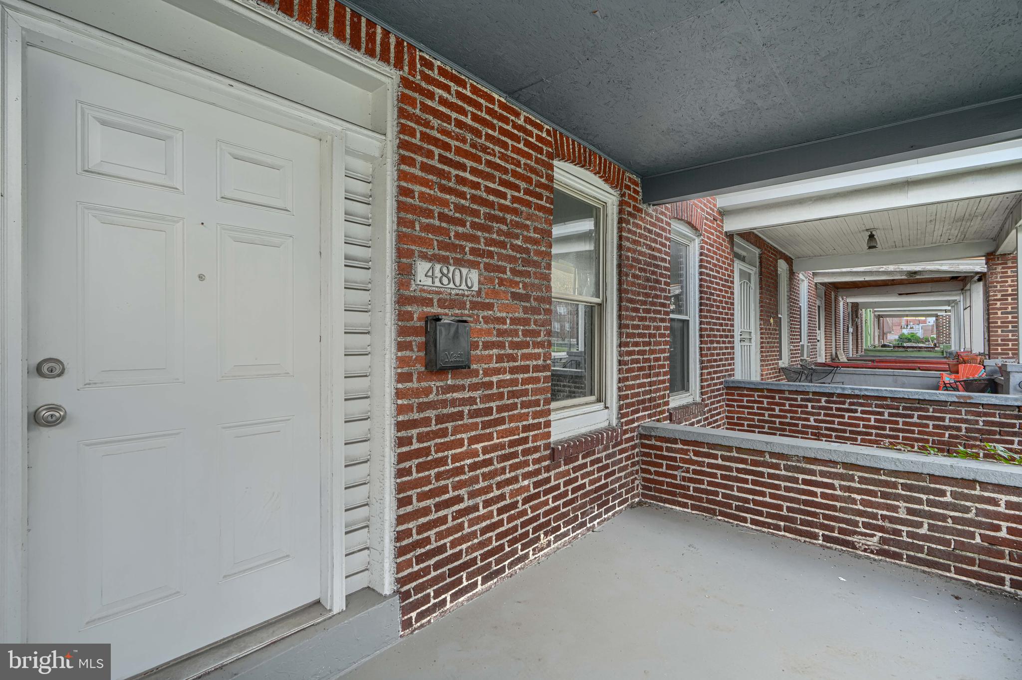 4806 Reisterstown Road Baltimore, MD 21215 - Photo 3 of 34 a view of a porch with a door and wooden floor