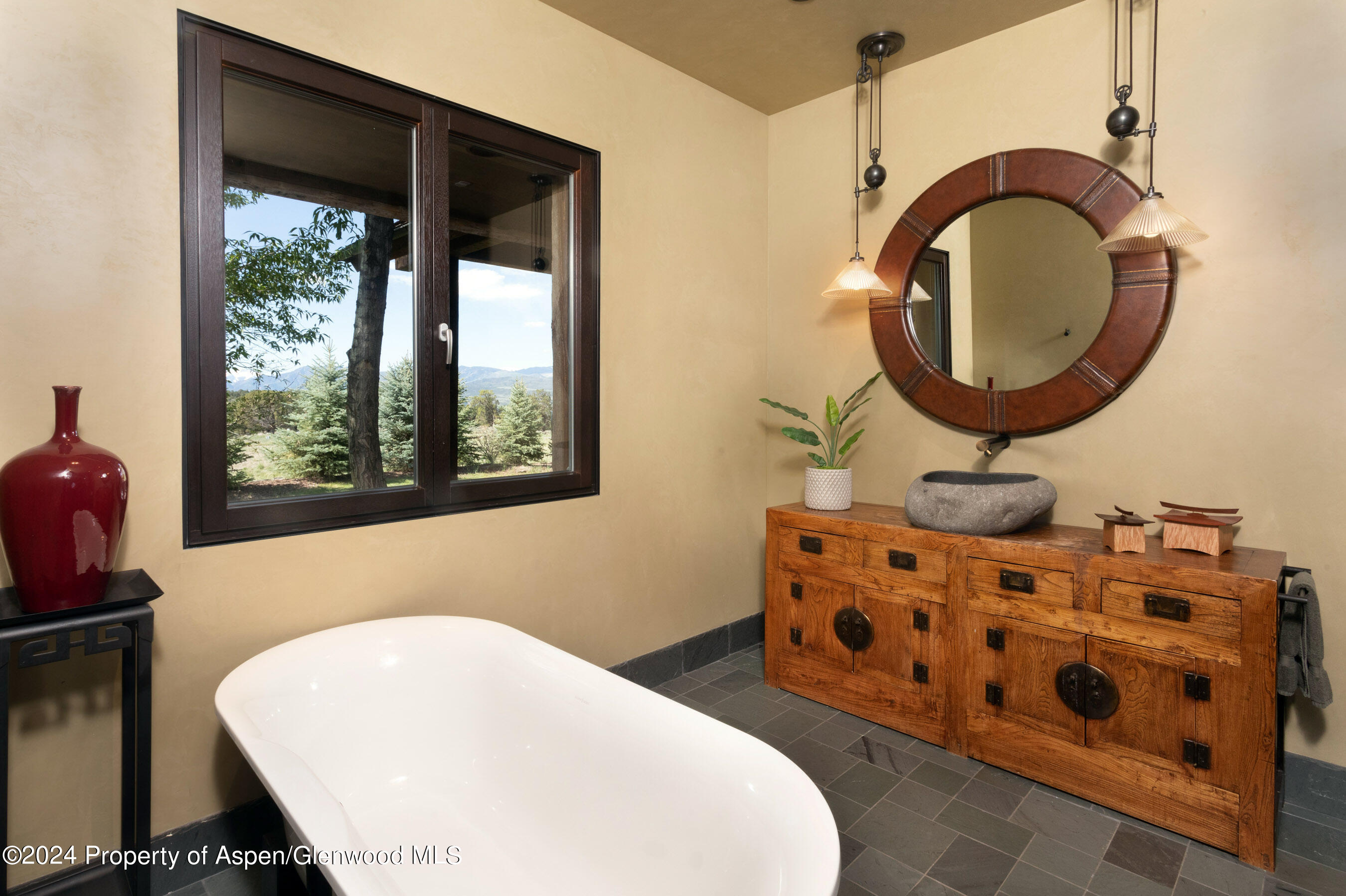 665 Callicotte Ranch Drive Carbondale, CO 81623 - Photo 15 of 39 a bathroom with a sink and a mirror