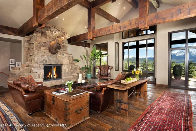 a living room with fireplace furniture and a fireplace