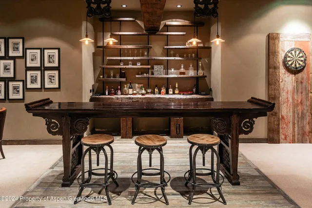 a kitchen with a dining table and chairs