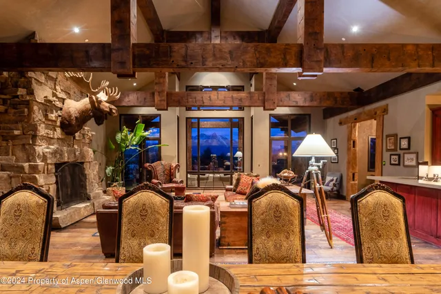 a living room with fireplace furniture and a fireplace