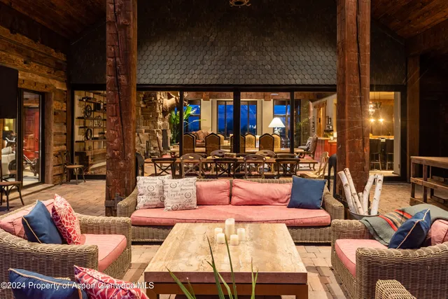 a outdoor living area with furniture and a large window