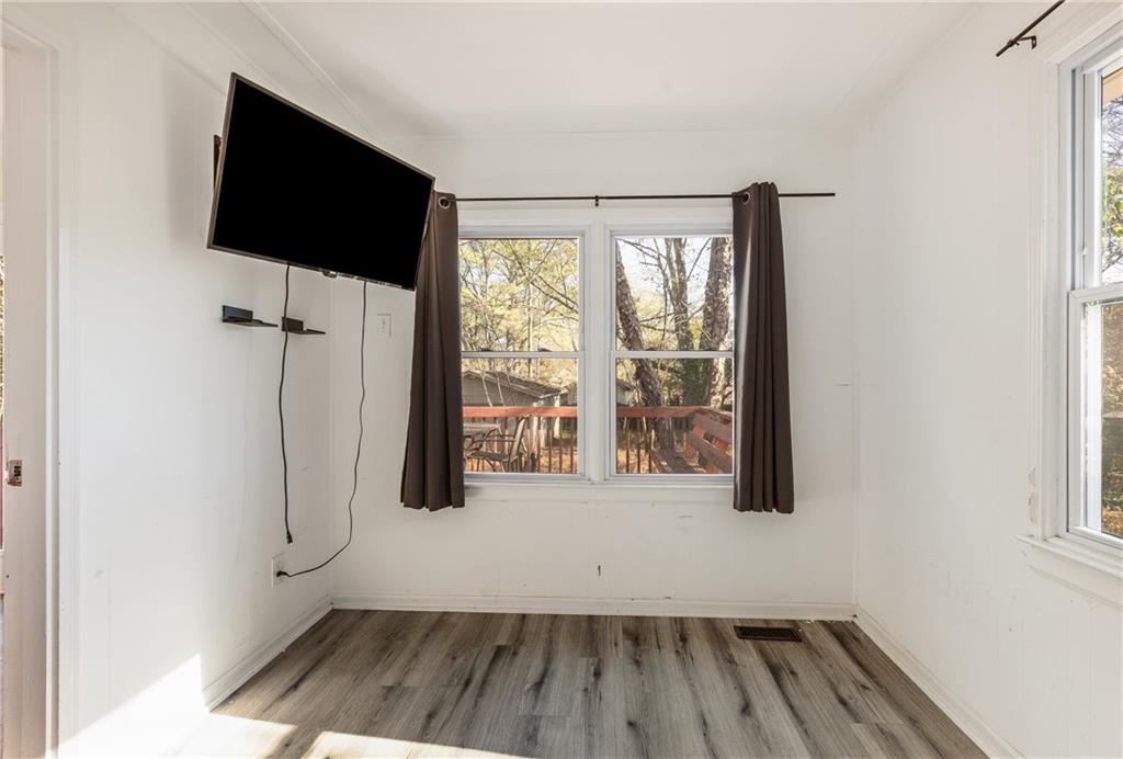 5287 Maple Valley Road Southwest Mableton, GA 30126 - Photo 19 of 29 a view of a room with wooden floor and windows