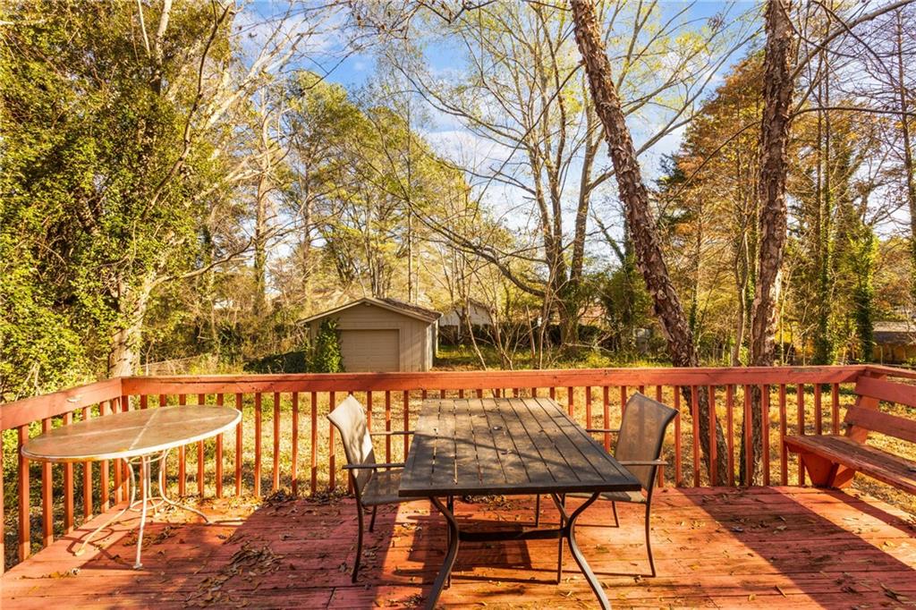 5287 Maple Valley Road Southwest Mableton, GA 30126 - Photo 21 of 29 a view of a roof deck with wooden floor and fence