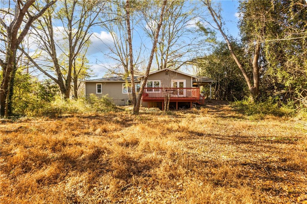 5287 Maple Valley Road Southwest Mableton, GA 30126 - Photo 23 of 29 a house with trees in front of it