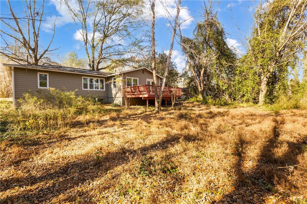 5287 Maple Valley Road Southwest Mableton, GA 30126 - Photo 24 of 29 a view of a house with a large tree and a yard