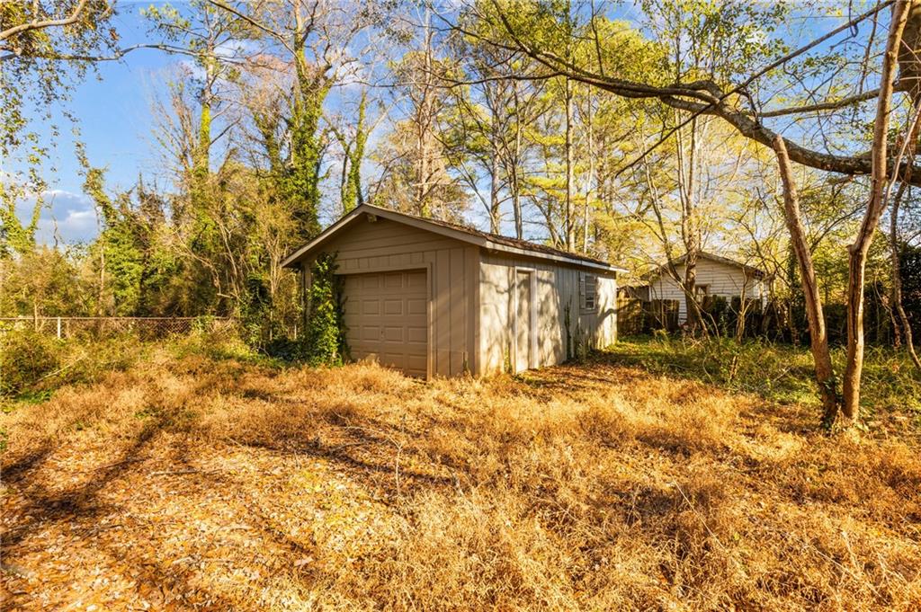 5287 Maple Valley Road Southwest Mableton, GA 30126 - Photo 25 of 29 a house with a tree in front of it
