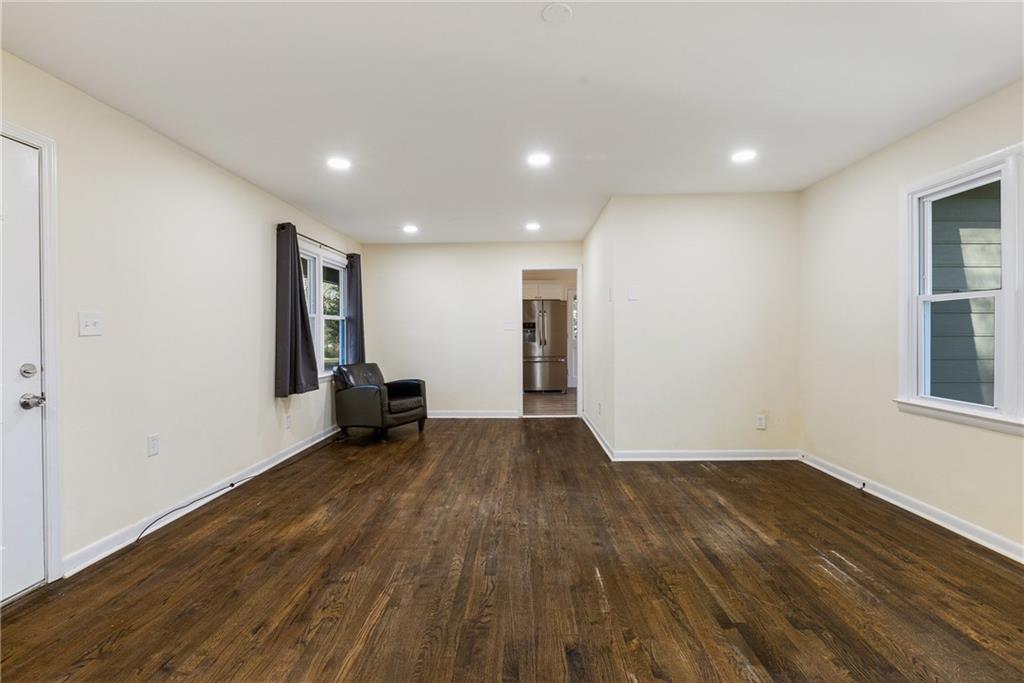 5287 Maple Valley Road Southwest Mableton, GA 30126 - Photo 3 of 29 a view of empty room with wooden floor and fan