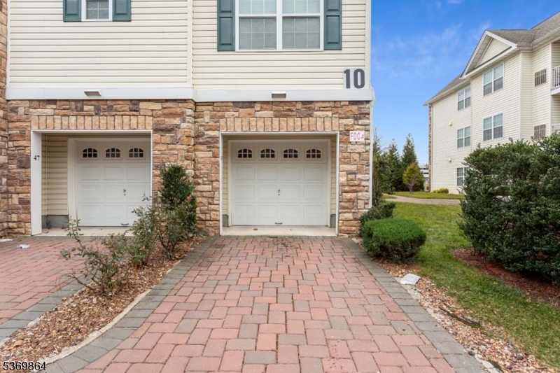151 Rosewood Avenue Springfield, NJ 07081 - Photo 2 of 15 a front view of a house with garden