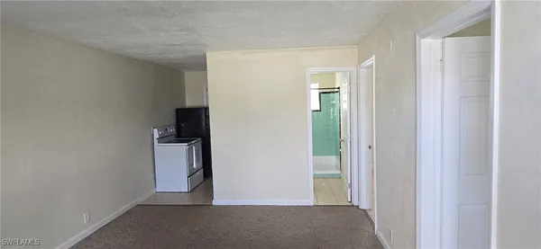a view of a room with a hallway