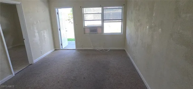 an empty room that has a window