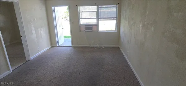 an empty room that has a window