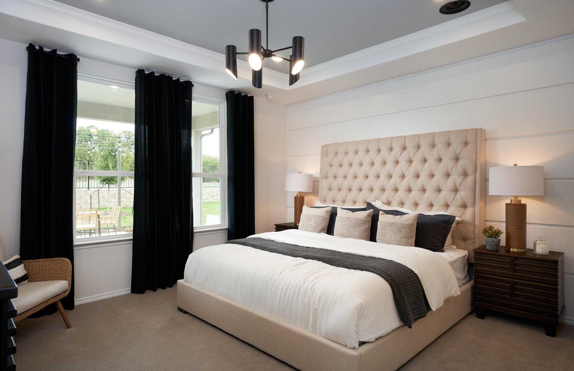 1375 Haven Circle Vero Beach, FL 32960 - Photo 21 of 36 a bedroom with a large bed and a chandelier