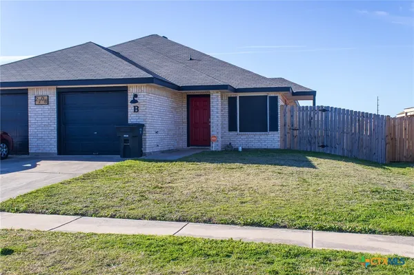 a front view of a house having yard