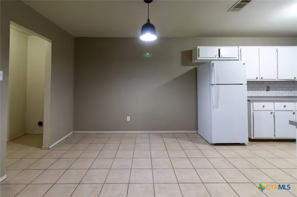 a view of a kitchen with a sink