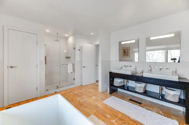 a spacious bathroom with a shower tub and sink