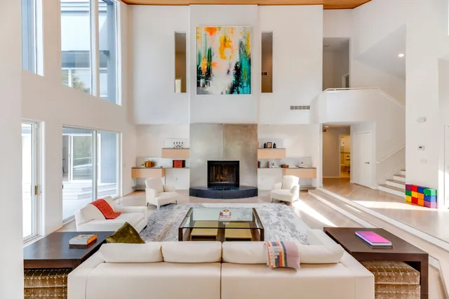 a living room with furniture fireplace and flat screen tv