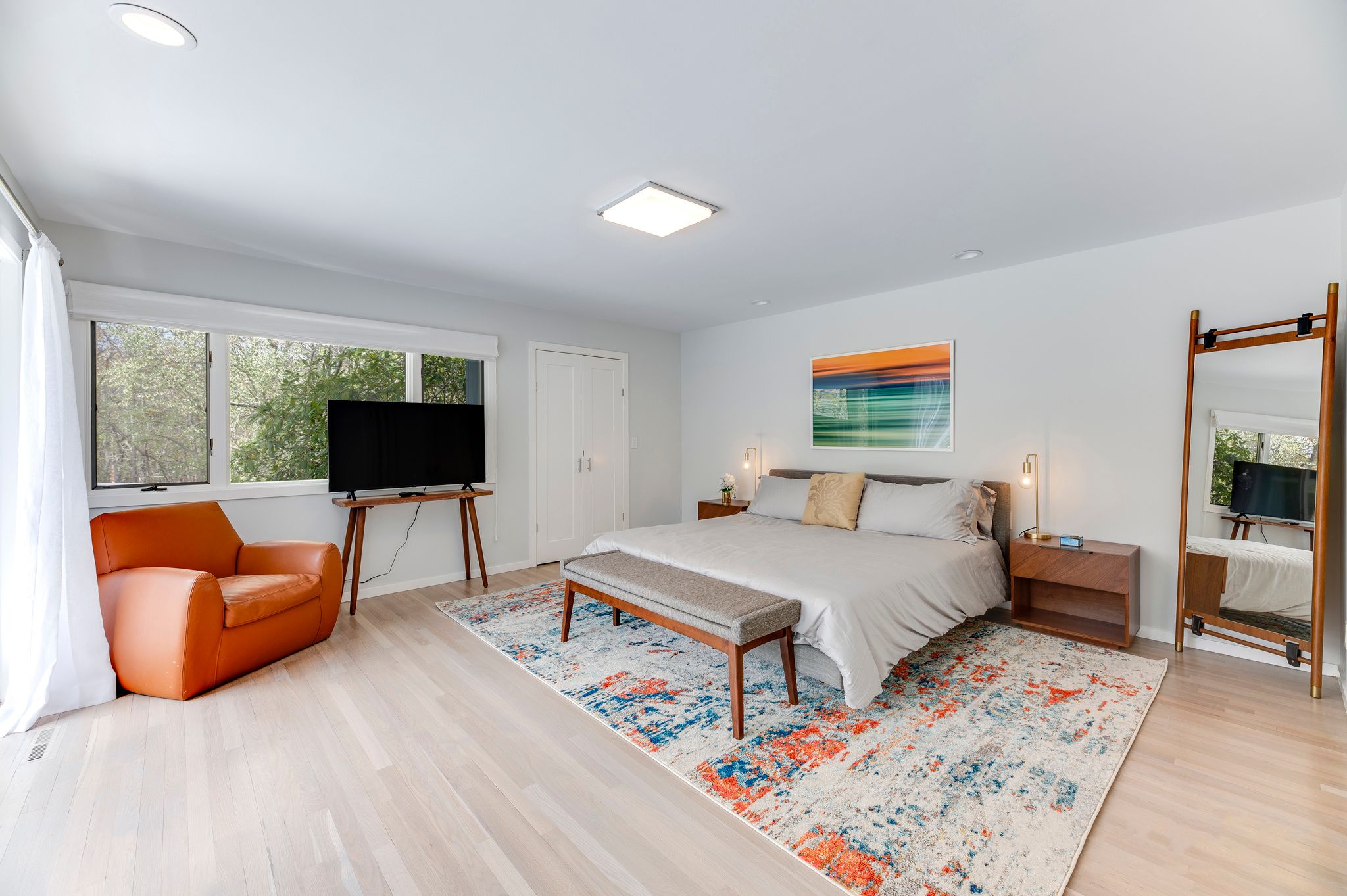 249 Roses Grove Road Water Mill, NY 11976 - Photo 14 of 21 a bedroom with furniture and a flat screen tv