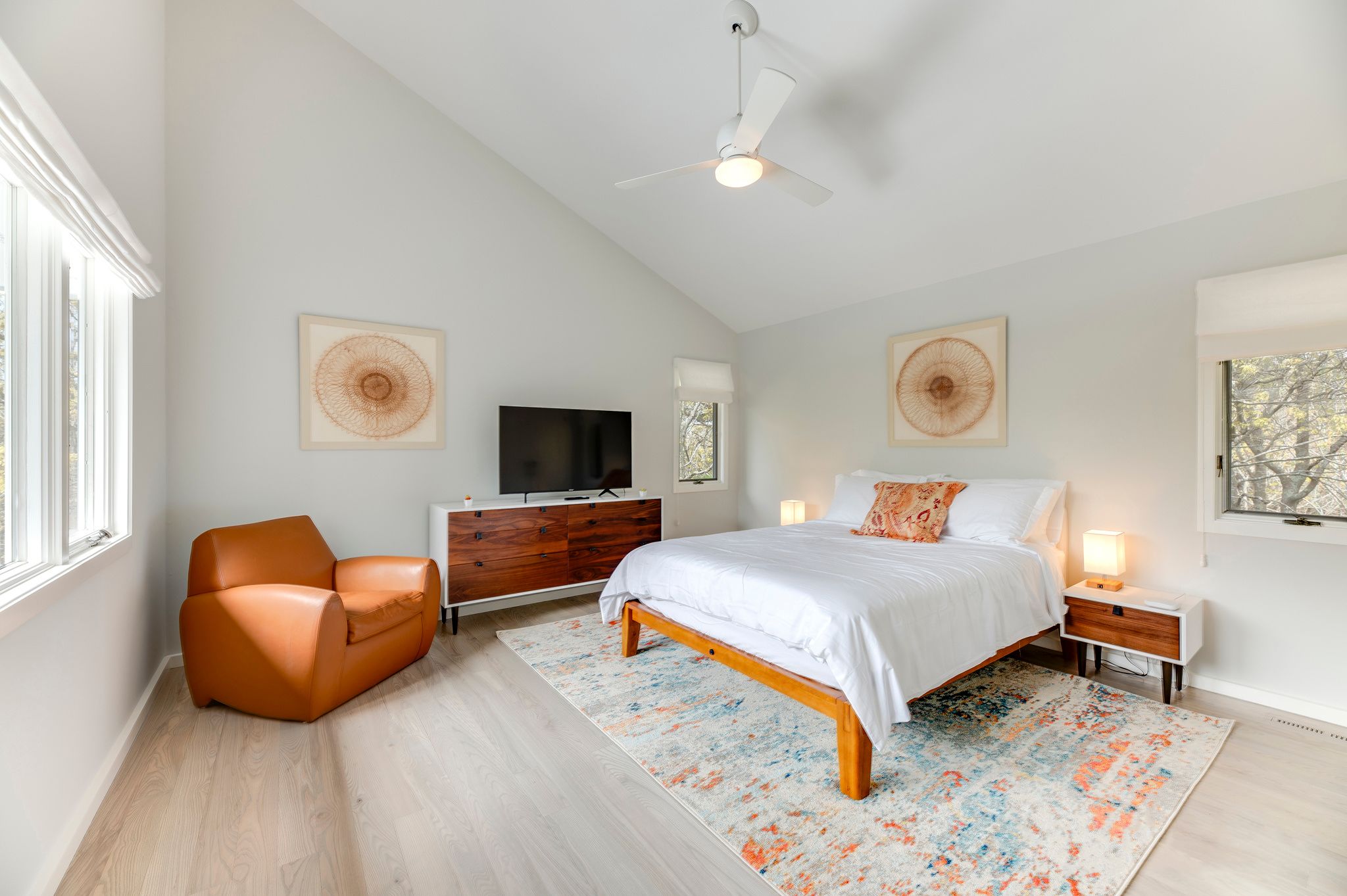 249 Roses Grove Road Water Mill, NY 11976 - Photo 15 of 21 a bedroom with furniture and a flat screen tv