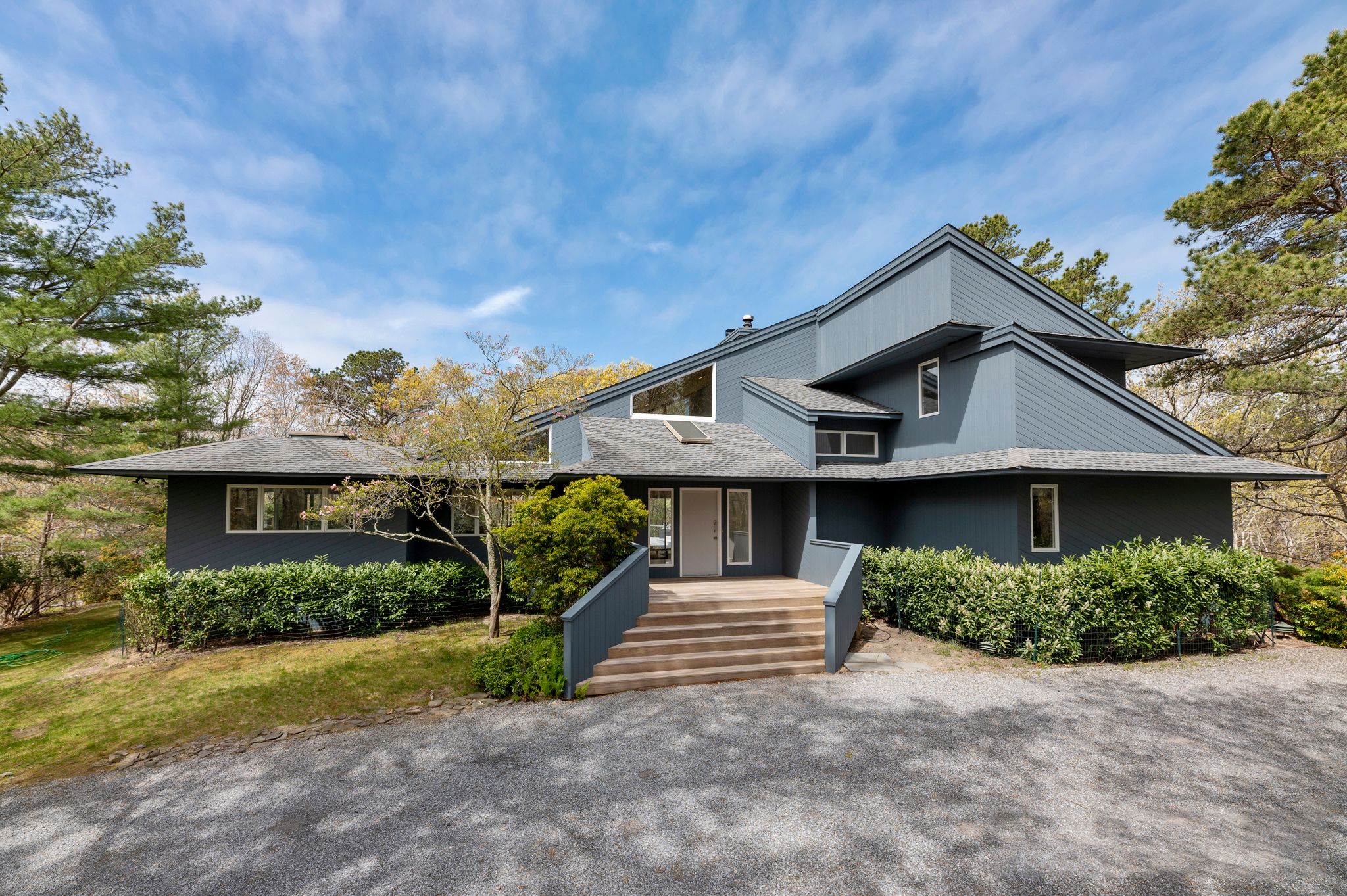 249 Roses Grove Road Water Mill, NY 11976 - Photo 2 of 21 a front view of a house with garden