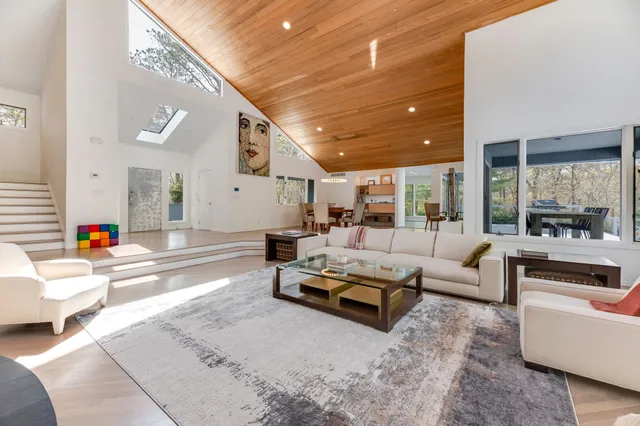 a living room with furniture and a table