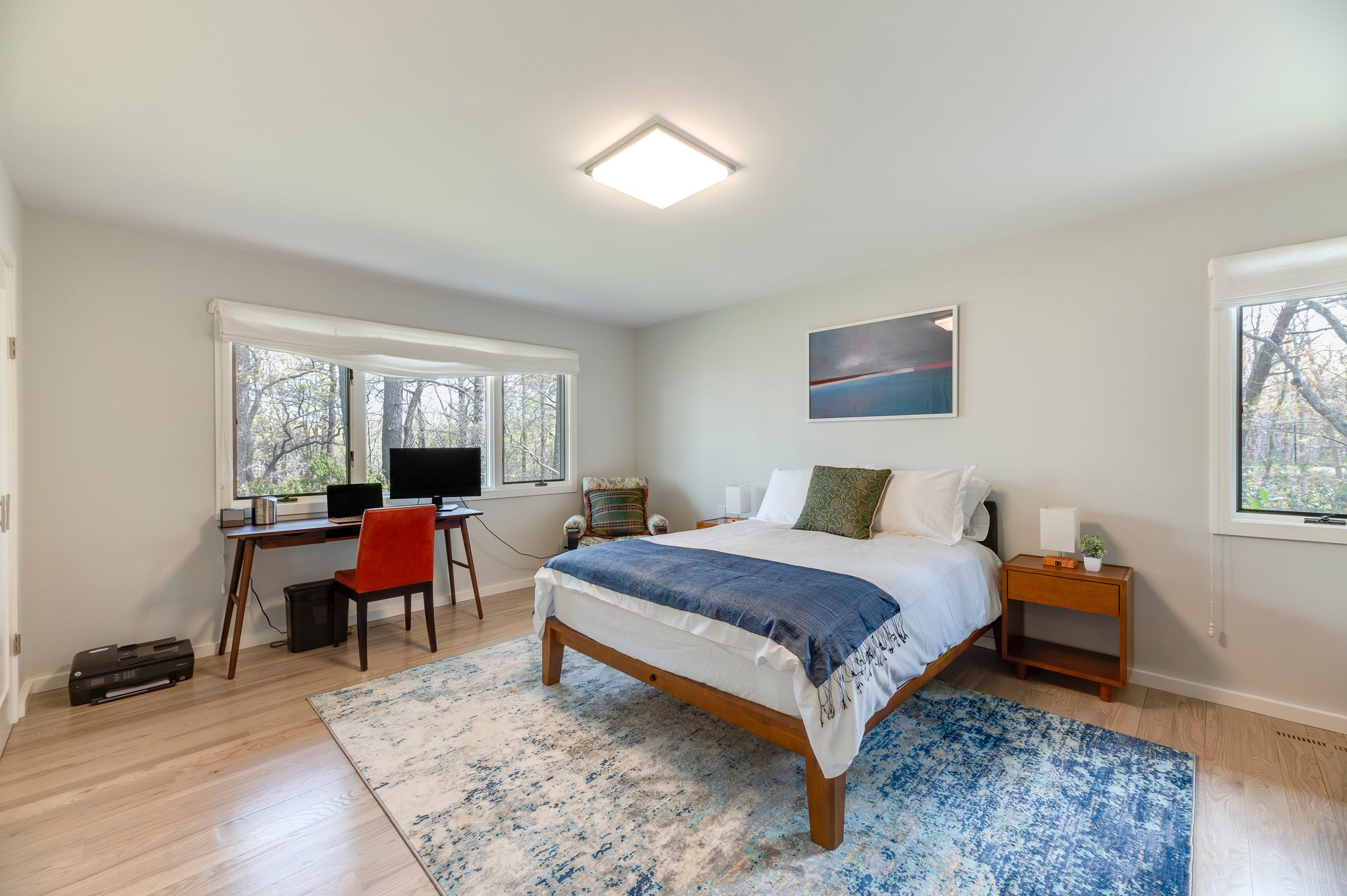 249 Roses Grove Road Water Mill, NY 11976 - Photo 10 of 21 a spacious bedroom with a bed and a window