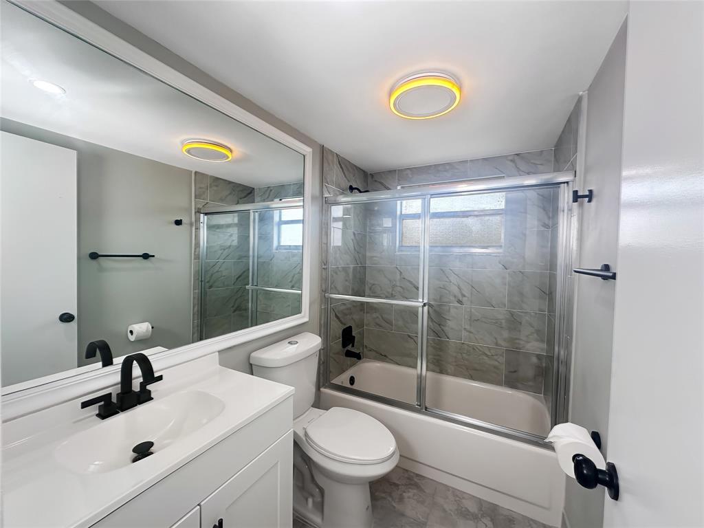 268 Saxony Circle, Unit 268 Delray Beach, FL 33446 - Photo 15 of 28 a bathroom with a sink toilet and shower