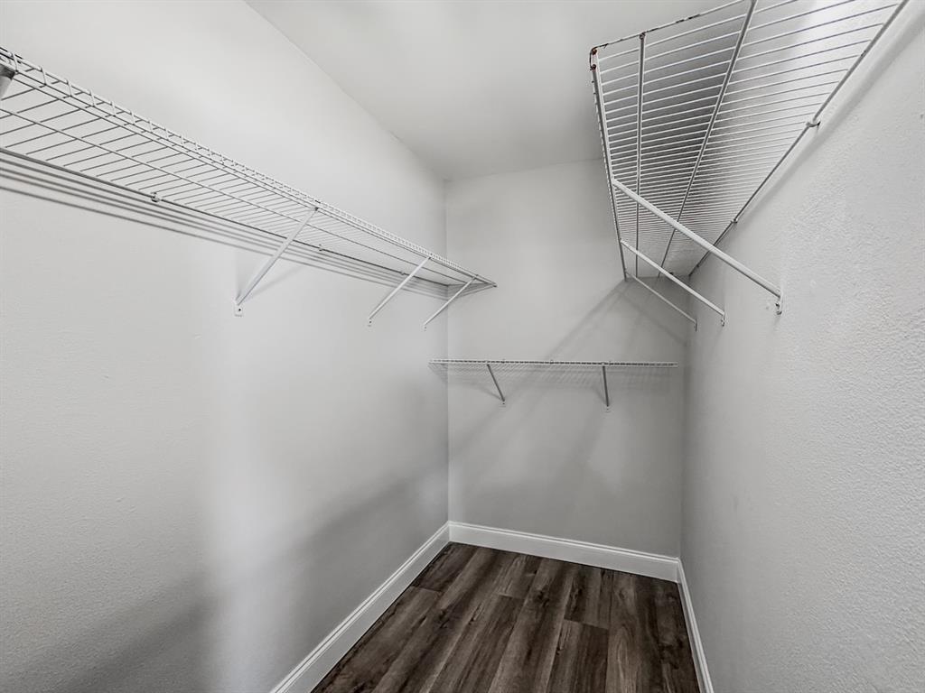 268 Saxony Circle, Unit 268 Delray Beach, FL 33446 - Photo 17 of 28 a view of a room with racks on the wall