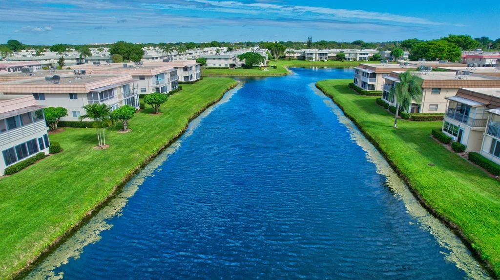 268 Saxony Circle, Unit 268 Delray Beach, FL 33446 - Photo 18 of 28 a view of a backyard with a garden